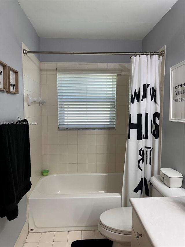 full bathroom with shower / bath combo, tile patterned flooring, vanity, and toilet