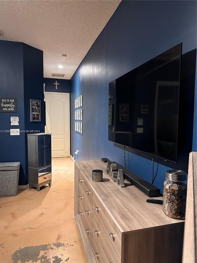 interior space featuring a textured ceiling