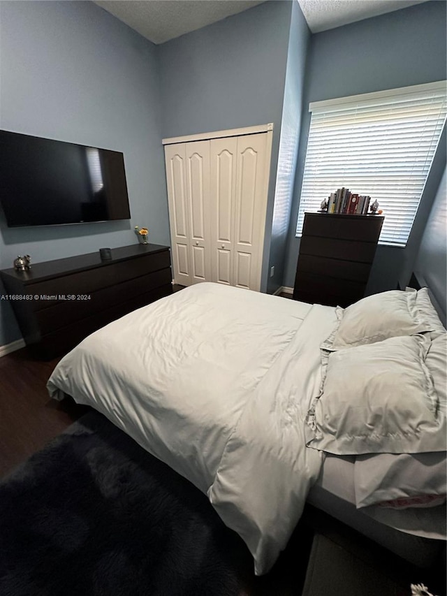 bedroom with a closet and a textured ceiling