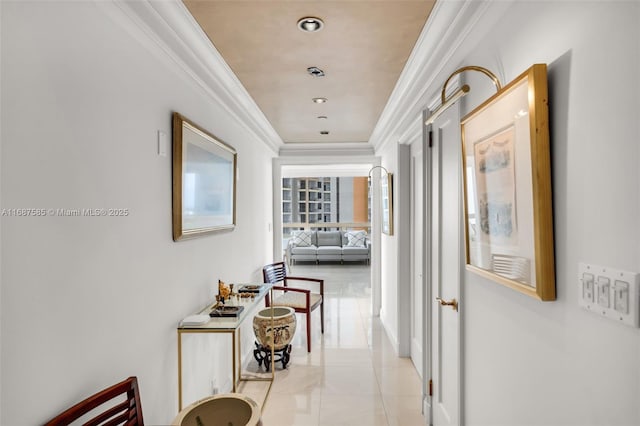 corridor with crown molding and light tile patterned flooring