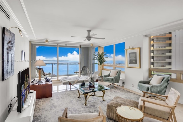 living room with ceiling fan, crown molding, and expansive windows