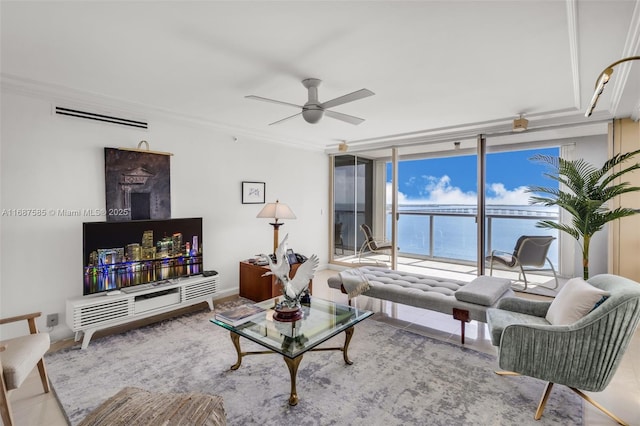 living room featuring ceiling fan, a wall of windows, and crown molding