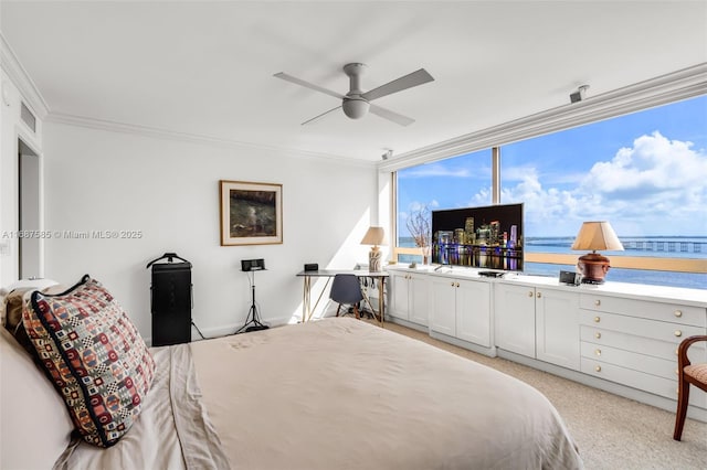 bedroom featuring ceiling fan, crown molding, and light colored carpet