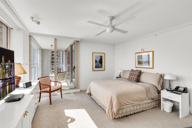 carpeted bedroom featuring ceiling fan and ornamental molding