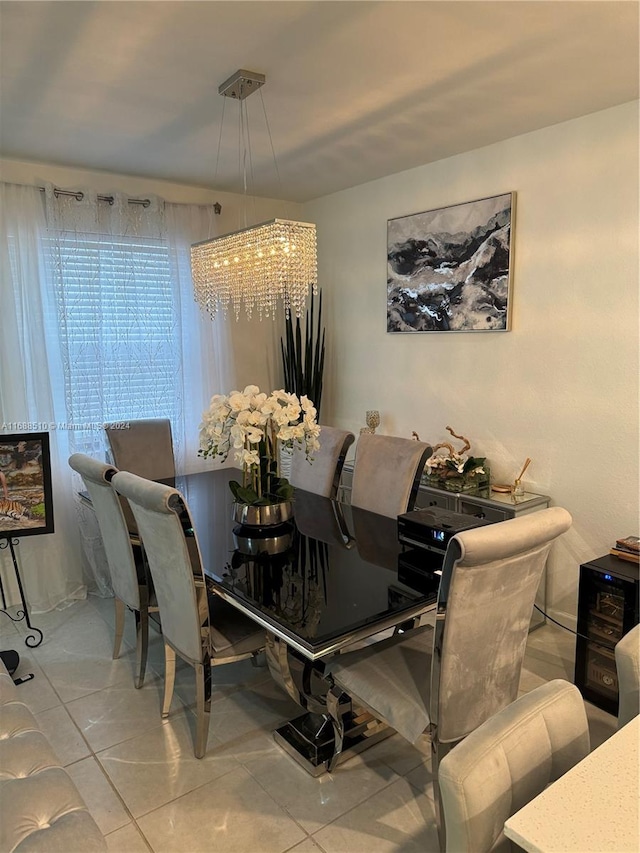 dining room with a chandelier and light tile patterned floors