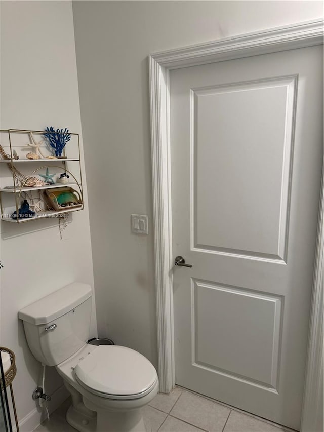 bathroom featuring toilet and tile patterned floors