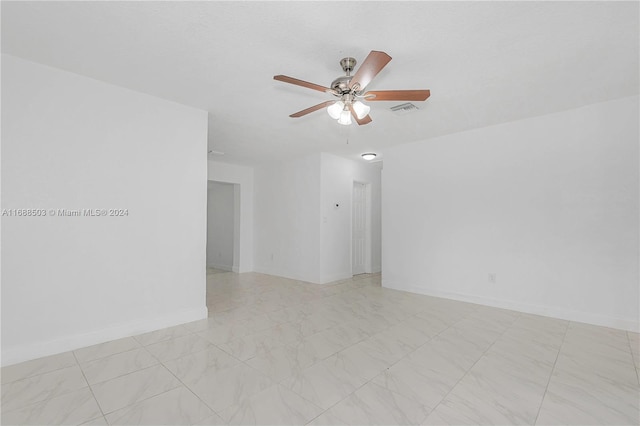 spare room with ceiling fan