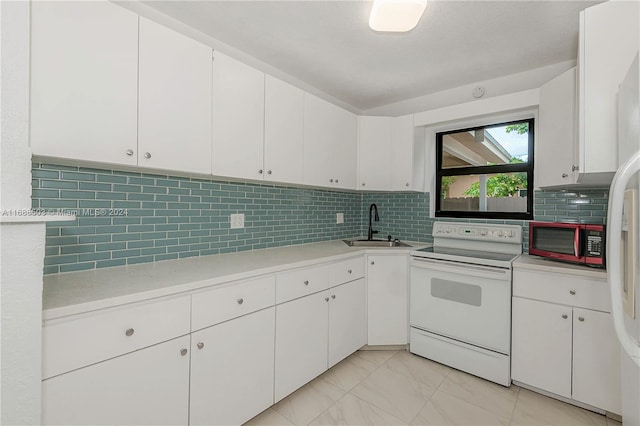 kitchen with white cabinetry, sink, backsplash, and electric range