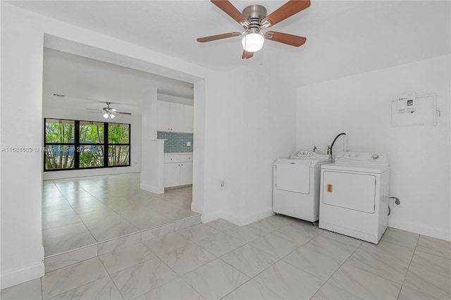 laundry room featuring electric panel, independent washer and dryer, and ceiling fan