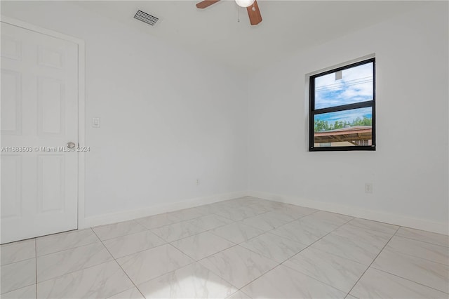 unfurnished room featuring ceiling fan