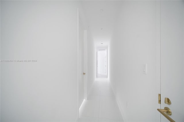 hallway with light tile patterned flooring