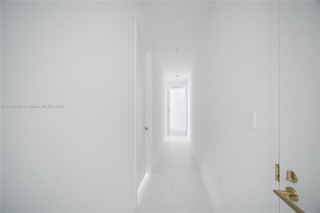2655 S Bayshore Dr Unit 1602, Coconut Grove, FL 33133 - hallway featuring light tile patterned flooring
