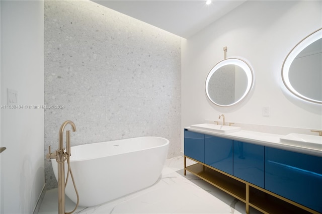 bathroom with a tub to relax in and vanity