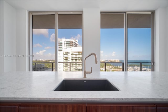 2655 S Bayshore Dr Unit 1602, Coconut Grove, FL 33133 - kitchen featuring a sink, healthy amount of natural light, light stone countertops, and floor to ceiling windows