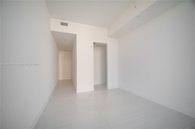 empty room with light tile patterned floors