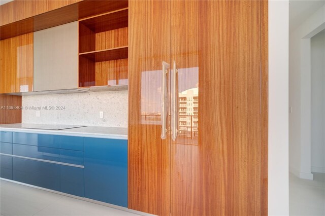 2655 S Bayshore Dr Unit 1602, Coconut Grove, FL 33133 - kitchen featuring modern cabinets, light countertops, open shelves, blue cabinets, and tasteful backsplash