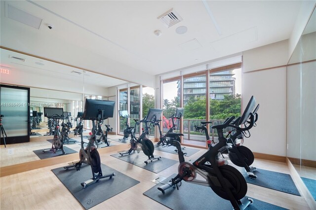2655 S Bayshore Dr Unit 1602, Coconut Grove, FL 33133 - workout area featuring wood finished floors and baseboards