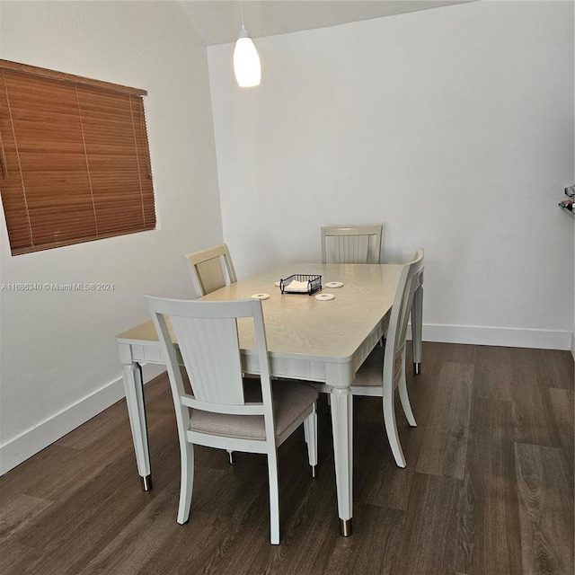 dining space featuring dark hardwood / wood-style flooring