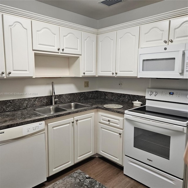 kitchen featuring white cabinetry, white appliances, sink, and dark hardwood / wood-style floors