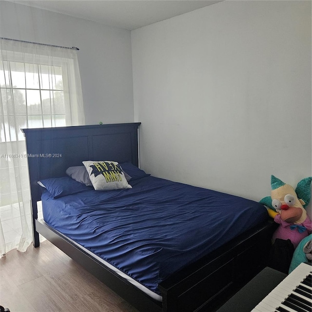 bedroom featuring hardwood / wood-style floors