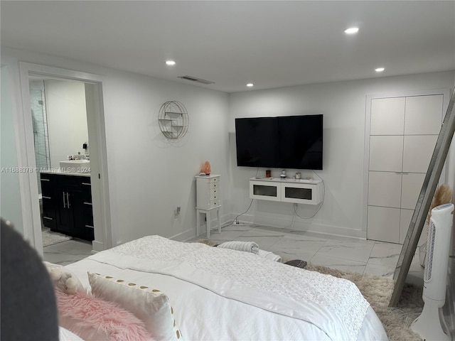 bedroom featuring ensuite bath