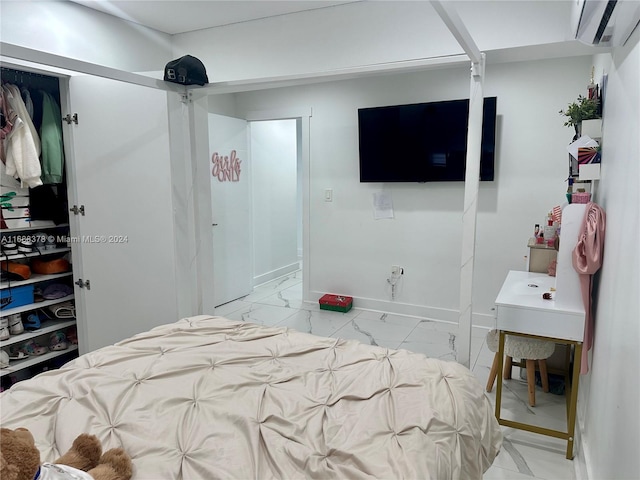 bedroom featuring a wall mounted air conditioner