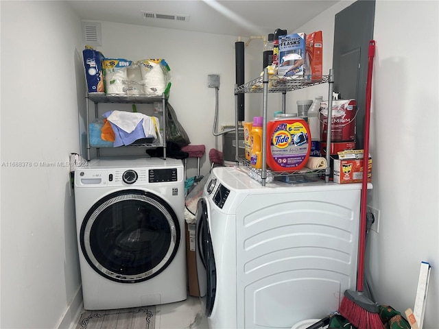 laundry area with separate washer and dryer