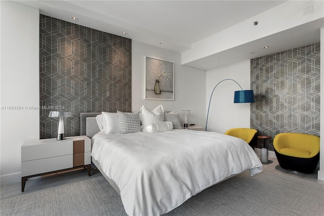 bedroom featuring tile walls and carpet floors