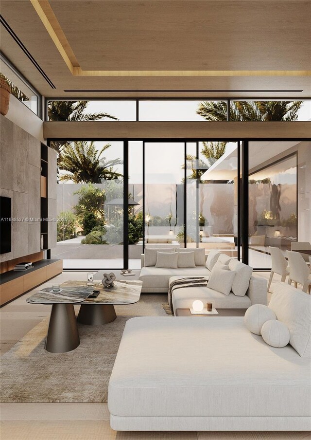 living room featuring a towering ceiling and wooden ceiling