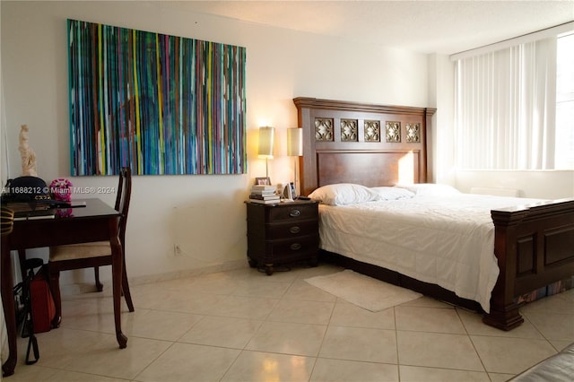 bedroom featuring light tile patterned floors