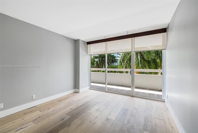 spare room with light wood-type flooring