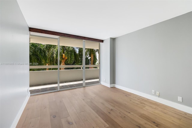 unfurnished room featuring light hardwood / wood-style floors