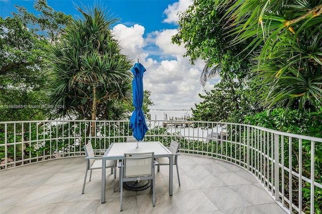 view of patio with a water view