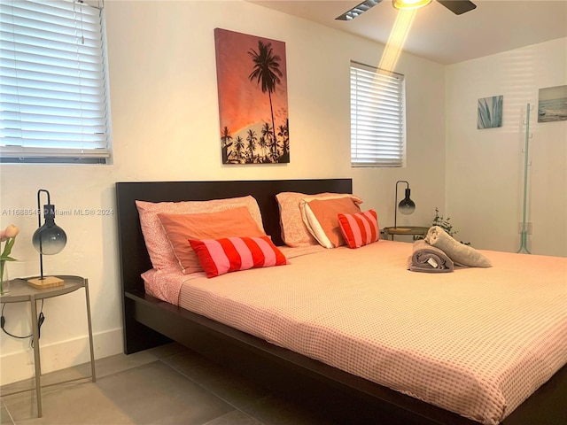 bedroom with tile patterned flooring and ceiling fan