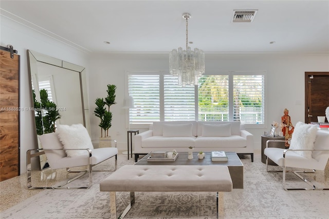 living room featuring a barn door, a notable chandelier, and ornamental molding