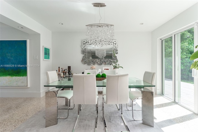 dining area with a notable chandelier