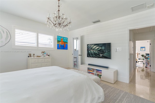 bedroom with a notable chandelier