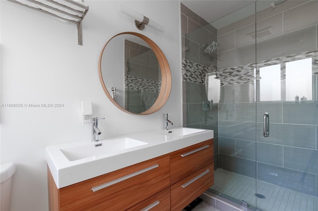 bathroom with walk in shower and vanity