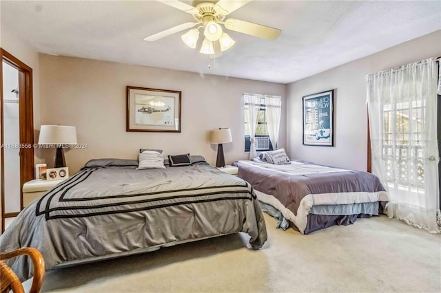 carpeted bedroom with access to outside and ceiling fan