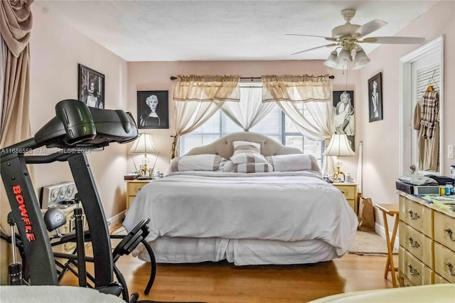 bedroom with hardwood / wood-style flooring and ceiling fan