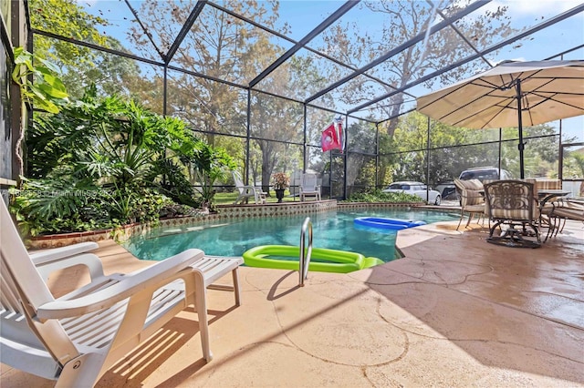 view of pool featuring a lanai and a patio area