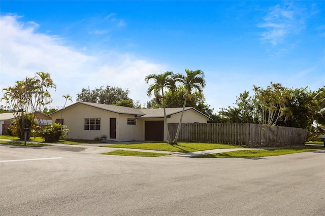 single story home featuring a garage