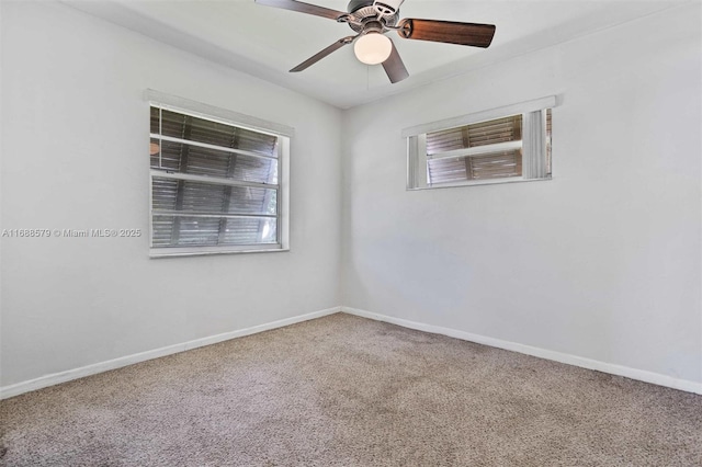 spare room with ceiling fan, a healthy amount of sunlight, and carpet flooring