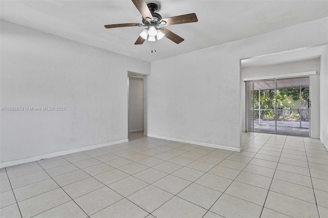 spare room with light tile patterned flooring and ceiling fan