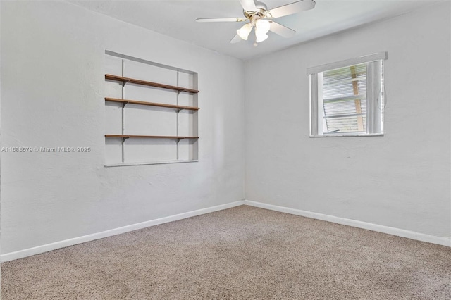 spare room with ceiling fan and carpet flooring