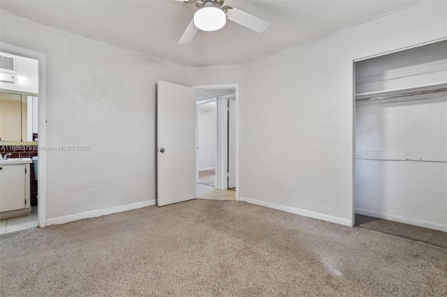 unfurnished bedroom featuring a closet and ceiling fan