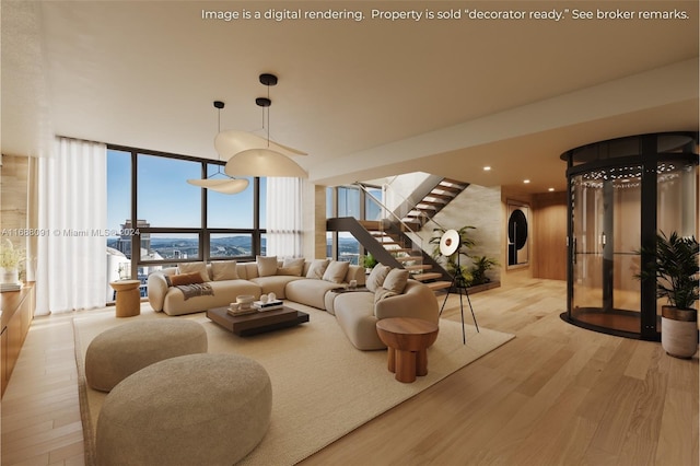 living room with light hardwood / wood-style floors and floor to ceiling windows