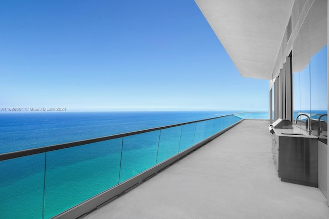 balcony featuring a water view