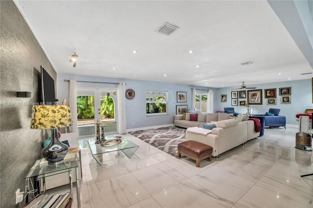 living room featuring ceiling fan