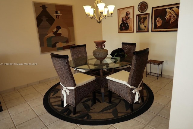 tiled dining space featuring an inviting chandelier